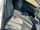 the back seat of a car with a bag in the back of it