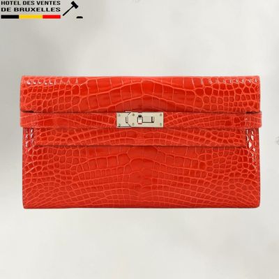 an image of a red purse with a metal clasp on it