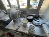 pots and pans are on a metal rack in a kitchen