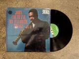 the vinyl album is laying on the floor with a trumpet