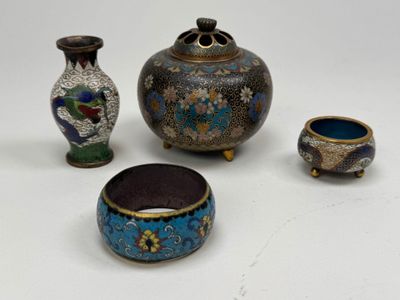 four different types of vases and bowls on a white surface