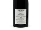 a bottle of wine that is sitting on a table