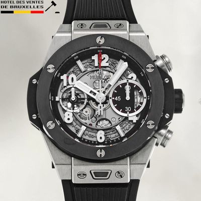 a picture of a black and silver watch on a white background