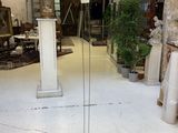 a floor lamp that is standing in the middle of a room