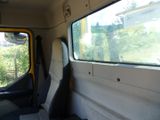 a view of the inside of a bus with the window open