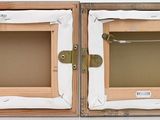 two open wooden boxes on a white surface