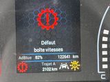 a close up of a car dashboard with a clock on it