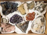 a box full of different colored rocks in it