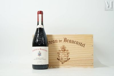 a bottle of wine sitting next to a wooden box