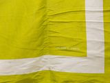 a yellow and white towel with a white stripe on it