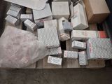 a pile of boxes and packages sitting on a pallet