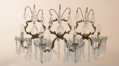 three chandeliers hanging from the ceiling in a room