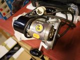 a close up of a fishing reel on a table