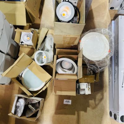 many boxes of different types of lighting on the floor