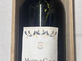 a bottle of wine in a wooden box on a table