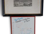 two framed photographs of a map and a picture of a polar bear