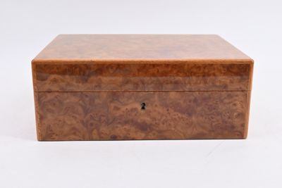 a small wooden box with a lock on top of it