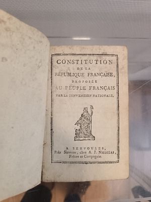 a book that is sitting on a shelf in a case