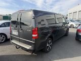 a black van that is parked in a parking lot