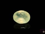 an image of a green jade stone on a black surface