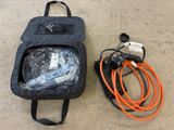 a black bag with an orange hose and a black bag with an orange hose