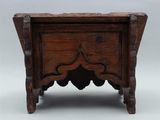 an old wooden table with a carved top on a white background