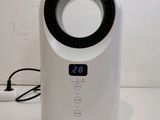an image of a white air purifier sitting on top of a counter