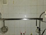 a bathroom with a sink and a shower with a shower head
