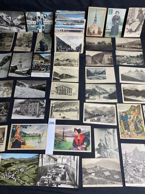 several old postcards and pictures of people and buildings on a table