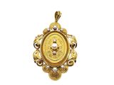 a close up of a gold pendant with pearls on a white background