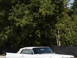 a white car that is parked in a parking lot