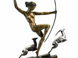 bronze statue of a man with a bow and a bird on a wooden base