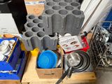 many pots and pans that are sitting on a pallet