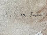 an old book with writing on it sitting on top of a table