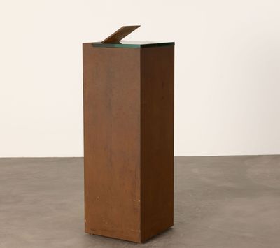 an image of a sculpture of a piece of wood with a piece of glass on top of it