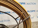 an image of a close up of a coil of wire on the ground