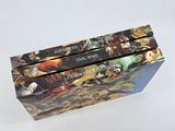 three books are stacked on top of each other on a white surface