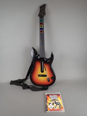 a guitar and a video game on the table
