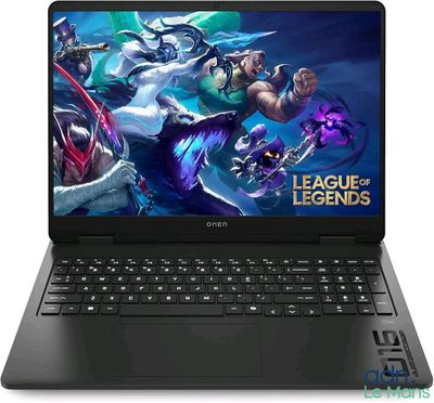 the laptop is open with a league of legends logo on the screen