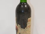 a bottle of wine that is sitting on a table