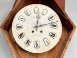 a clock with roman numerals on the face of it