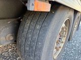a close up of a truck tire on the road