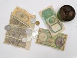 a lot of money and coins on the table