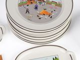 several plates and chopsticks are sitting on a white table