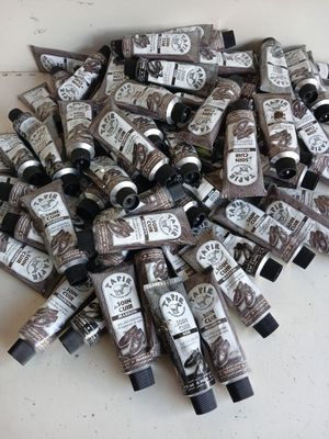 many tubes of hand creams on a table