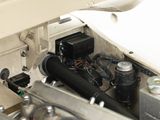 a close up of a car engine with the hood open