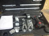 a tool kit in a black case on the floor