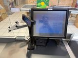an image of a cash register machine in a store