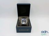 an image of a watch in a black box on a white surface