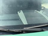 a car windshield with a wipe cloth on the windshield